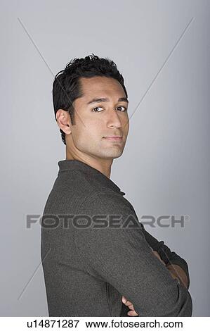 Studio shot portrait of mid adult man with arms crossed, head and shoulders View Large Photo Image Stock Photo - Studio shot portrait of mid adult man with arms crossed, head and shoulders. Fotosearch