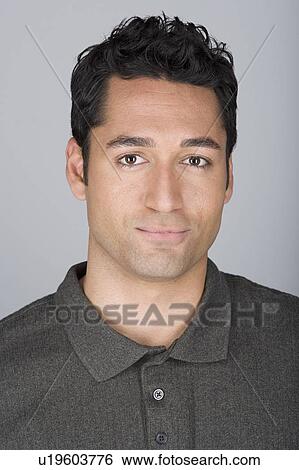 Stock Photograph - Studio shot portrait of mid adult man, head and shoulders. Fotosearch