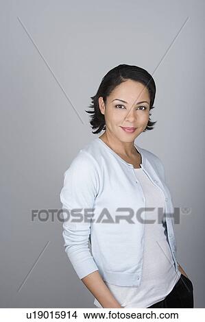 Studio shot portrait of mid adult woman, waist up View Large Photo Image Picture - Studio shot portrait of mid adult woman, waist up. Fotosearch