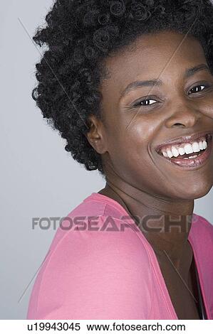 Studio shot portrait of smiling mid adult woman, close-up View Large Photo Image Stock Photography - Studio shot portrait of smiling mid adult woman, close-up. Fotosearch