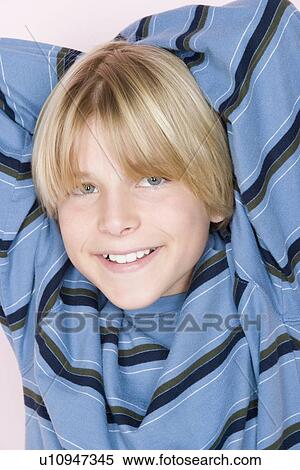 Studio shot portrait of teenage boy, close-up View Large Photo Image Stock Photography - Studio shot portrait of teenage boy, close-up. Fotosearch