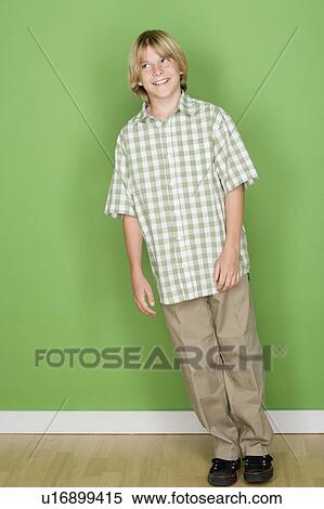 Studio shot portrait of teenage boy, full length View Large Photo Image Stock Photography - Studio shot portrait of teenage boy, full length. Fotosearch