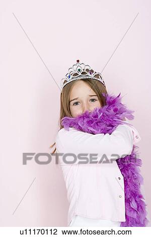 Studio shot portrait of teenage girl in diadem and feather boa shawl, waist up View Large Photo Image Stock Image - Studio shot portrait of teenage girl in diadem and feather boa shawl, waist up. Fotosearch