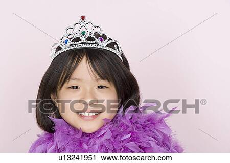 Studio shot portrait of teenage girl in diadem and feather boa shawl, head and shoulders View Large Photo Image Stock Image - Studio shot portrait of teenage girl in diadem and feather boa shawl, head and shoulders. Fotosearch