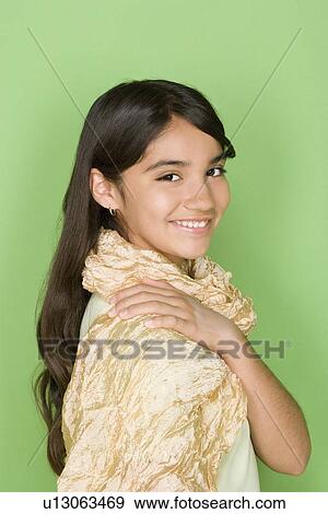 Stock Photo - Studio shot portrait of teenage girl, head and shoulders. Fotosearch