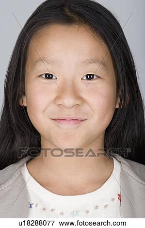 Studio shot portrait of teenage girl, close-up View Large Photo Image Stock Photo - Studio shot portrait of teenage girl, close-up. Fotosearch