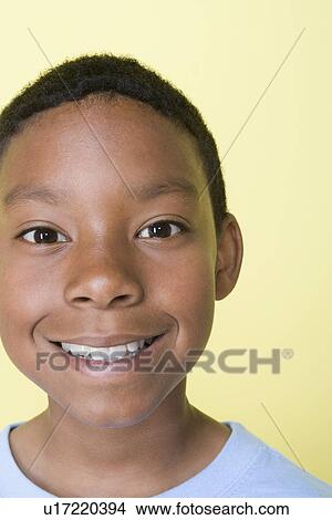 Picture - Studio shot portrait of young adult man, close-up. Fotosearch