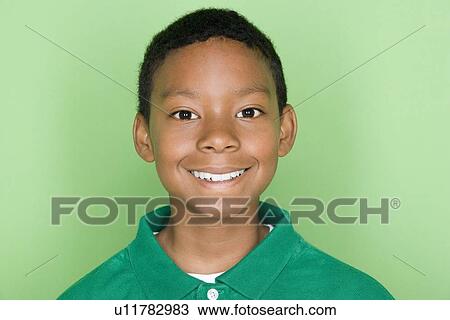 Studio shot portrait of young man in polo shirt, head and shoulders View Large Photo Image Stock Image - Studio shot portrait of young man in polo shirt, head and shoulders. Fotosearch