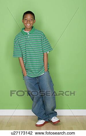 Studio shot portrait of young man with hands in pocket, full length View Large Photo Image Stock Image - Studio shot portrait of young man with hands in pocket, full length. Fotosearch
