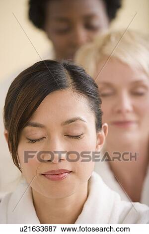 Stock Photo - Three women enjoying spa. Fotosearch