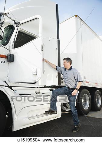 Truck driver entering truck View Large Photo Image Picture - Truck driver entering truck. Fotosearch