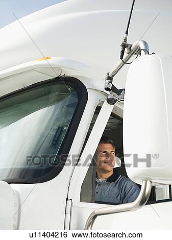 Truck driver sitting in truck View Large Photo Image Stock Photograph - Truck driver sitting in truck. Fotosearch