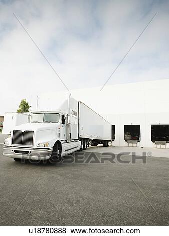 Stock Photo - Truck loading in warehouse. Fotosearch