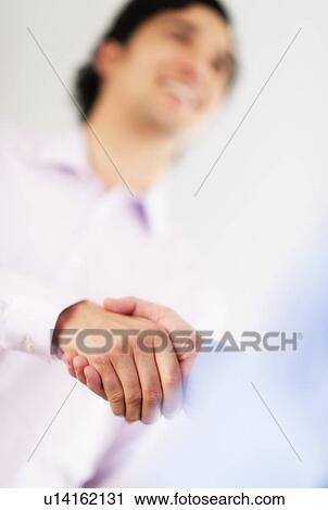 Two businessman shaking hands View Large Photo Image Stock Image - Two businessman shaking hands. Fotosearch