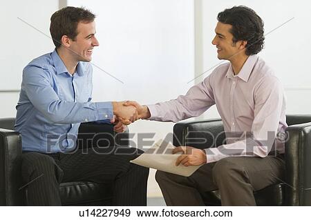 Stock Photo - Two businessman shaking hands. Fotosearch