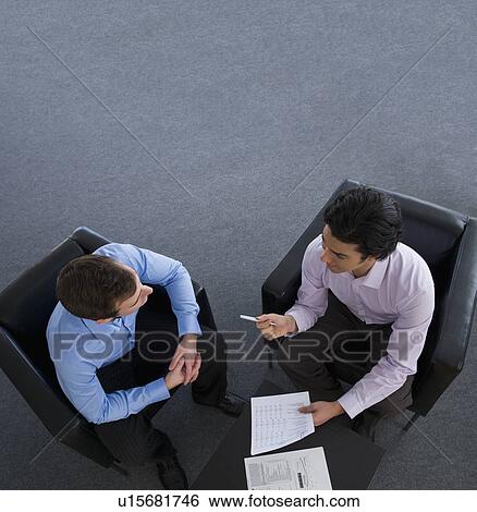 Stock Photograph - Two businessman talking. Fotosearch