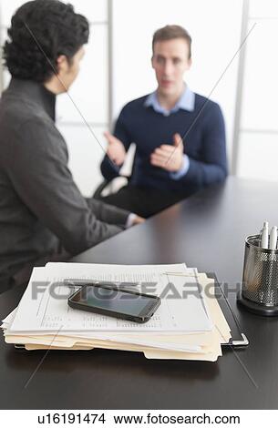 Two businessmen in discussion View Large Photo Image Picture - Two businessmen in discussion. Fotosearch