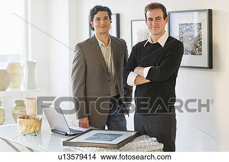 Two men working in art gallery View Large Photo Image Picture - Two men working in art gallery. Fotosearch