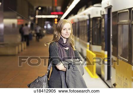 USA, California, Los Angeles, Woman standing on subway station View Large Photo Image Stock Photography - USA, California, Los Angeles, Woman standing on subway station. Fotosearch