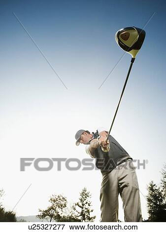 USA, California, Mission Viejo, Low angle view of man playing golf View Large Photo Image Stock Photo - USA, California, Mission Viejo, Low angle view of man playing golf. Fotosearch