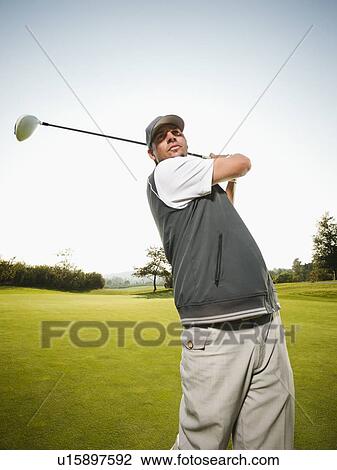 Stock Image - USA, California, Mission Viejo, Man playing golf. Fotosearch