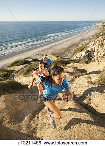 USA, California, San Diego, Three people jogging along sea coast View Large Photo Image Stock Photograph - USA, California, San Diego, Three people jogging along sea coast. Fotosearch
