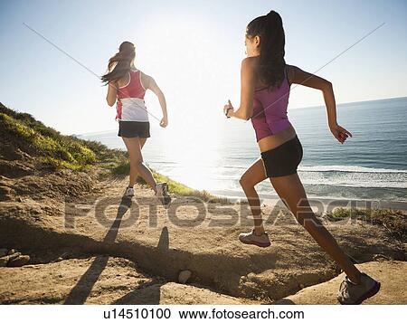 USA, California, San Diego, Two women jogging along sea coast View Large Photo Image Stock Image - USA, California, San Diego, Two women jogging along sea coast. Fotosearch