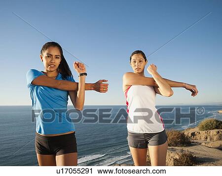 USA, California, San Diego, Two women stretching at sea coast View Large Photo Image Stock Image - USA, California, San Diego, Two women stretching at sea coast. Fotosearch