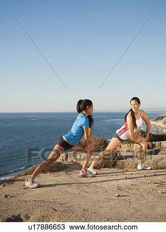 USA, California, San Diego, Two women stretching on beach View Large Photo Image Stock Image - USA, California, San Diego, Two women stretching on beach. Fotosearch