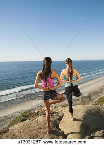 USA, California, San Diego, Two women practicing yoga on beach View Large Photo Image Stock Photo - USA, California, San Diego, Two women practicing yoga on beach. Fotosearch