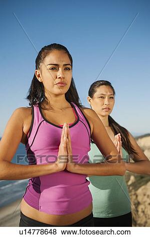 USA, California, San Diego, Two women practicing yoga on beach View Large Photo Image Stock Photo - USA, California, San Diego, Two women practicing yoga on beach. Fotosearch
