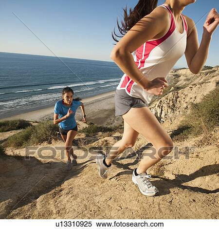 USA, California, San Diego, Two women jogging along sea coast View Large Photo Image Stock Photography - USA, California, San Diego, Two women jogging along sea coast. Fotosearch