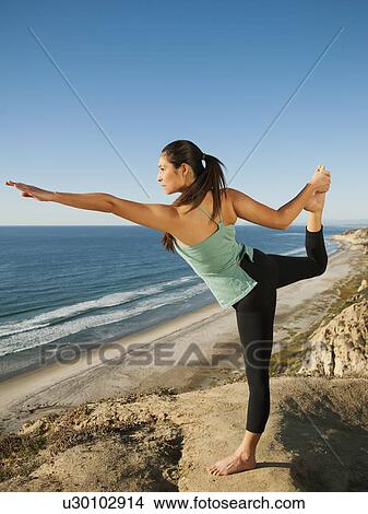 USA, California, San Diego, Woman practicing yoga on beach View Large Photo Image Picture - USA, California, San Diego, Woman practicing yoga on beach. Fotosearch