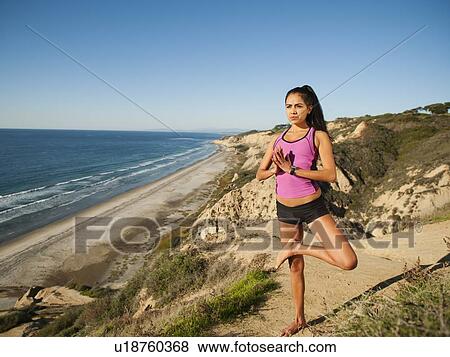 USA, California, San Diego, Woman practicing yoga on beach View Large Photo Image Stock Photo - USA, California, San Diego, Woman practicing yoga on beach. Fotosearch