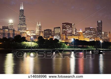 Stock Photograph - USA, Illinois, Chicago skyline at dusk. Fotosearch