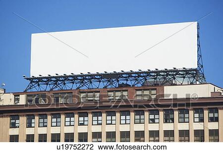Stock Image - USA, New York, New York City, Blank banner on top of building. Fotosearch