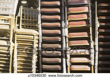 USA, New York, New York City, Close up of chairs in stacks View Large Photo Image Stock Image - USA, New York, New York City, Close up of chairs in stacks. Fotosearch