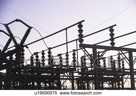 Stock Photography - USA, New York, New York City, Silhouette of transmission tower at dusk. Fotosearch