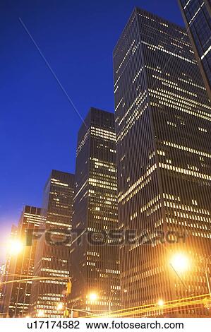 Stock Image - USA, New York State, New York City, 6th avenue at night. Fotosearch