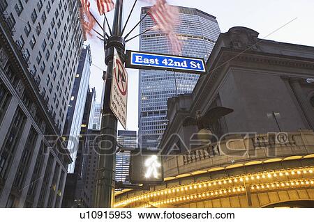 Stock Image - USA, New York State, New York City, low angle view of 42nd Street name sign with Met Life Building in distance. Fotosearch