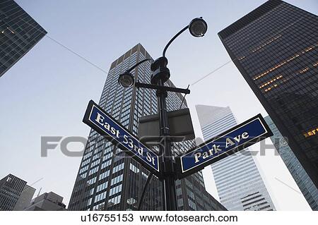 USA, New York State, New York City, low angle view of street name sign in front of building exterior View Large Photo Image Stock Image - USA, New York State, New York City, low angle view of street name sign in front of building exterior. Fotosearch