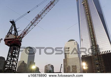Stock Image - USA, New York State, New York City, low angle view of illuminated skyscrapers. Fotosearch