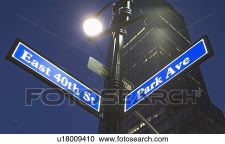 Stock Image - USA, New York State, New York City, low angle view of street name sign. Fotosearch