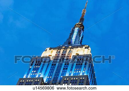 Stock Photograph - USA, New York State, New York City, Low angle view of Empire State Building. Fotosearch
