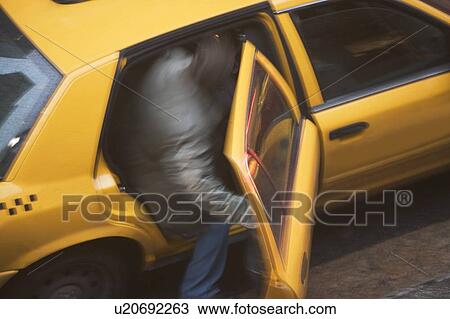 USA, New York state, New York city, man getting in to taxi View Large Photo Image Stock Image - USA, New York state, New York city, man getting in to taxi. Fotosearch