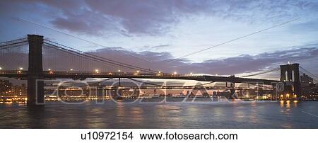 Picture - USA, New York State, New York City, Brooklyn Bridge at dusk. Fotosearch