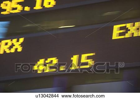 Usa, New York State, New York City, Times Square, Stock Quotron, close-up of Ticker Tape Machine View Large Photo Image Picture - Usa, New York State, New York City, Times Square, Stock Quotron, close-up of Ticker Tape Machine. Fotosearch