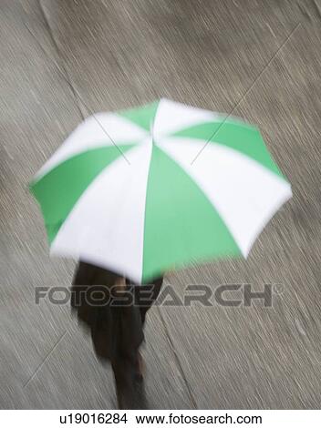 USA, New York state, New York city, pedestrian walking with umbrella View Large Photo Image Picture - USA, New York state, New York city, pedestrian walking with umbrella . Fotosearch