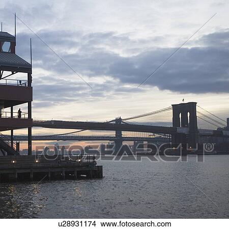Picture - USA, New York State, New York City, Brooklyn Bridge at dusk. Fotosearch