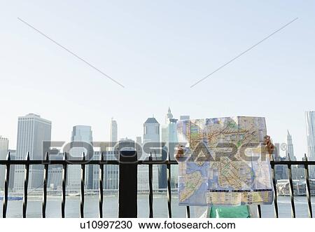 USA, New York State, New York City, Brooklyn, Woman holding map View Large Photo Image Stock Image - USA, New York State, New York City, Brooklyn, Woman holding map. Fotosearch